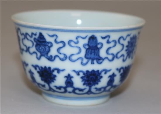 A Chinese blue and white Eight Buddhist emblems cup, bearing a Daoguang seal mark, diameter 7.3cm